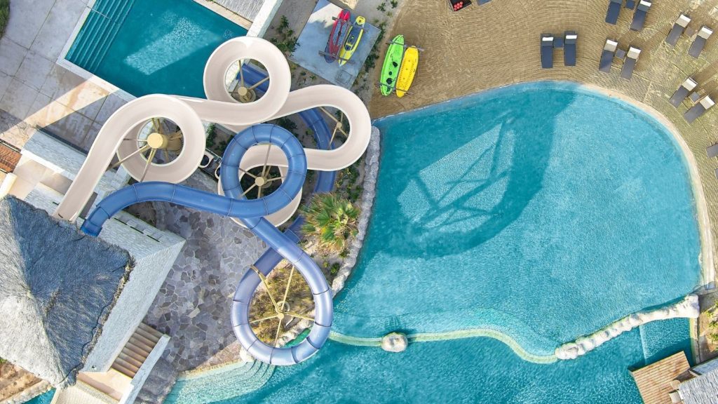 aerial view of waterslide and pool at Grand Solmar Rancho San Lucas, one of the best all-inclusive beach resorts