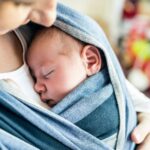 Mother carrying baby in a sling (Photo: Shutterstock)