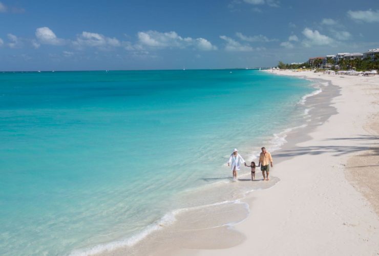 Family walking the beach at Beaches Turks and Caicos