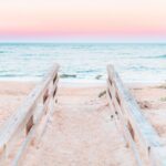 railings leading down to beach at sunset in St. Augustine, Florida