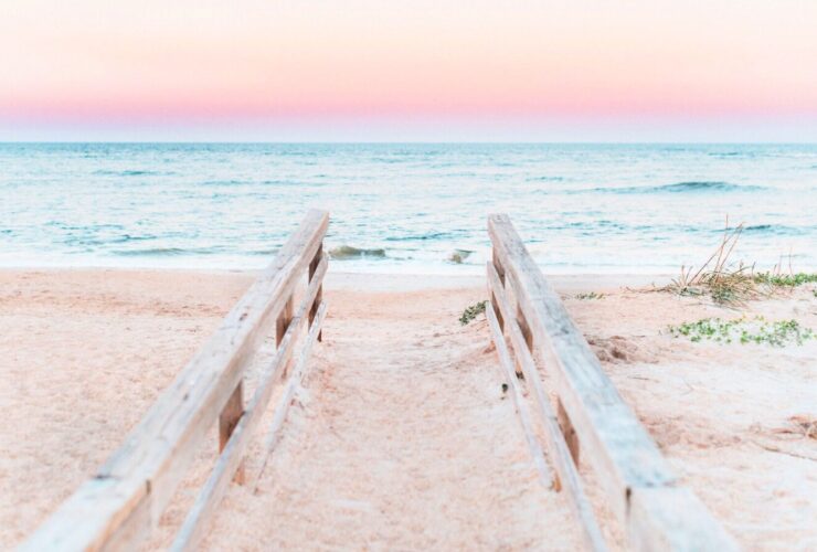 railings leading down to beach at sunset in St. Augustine, Florida