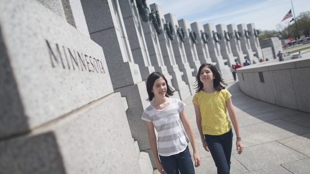 Two young teens walking along a memorial in Washington DC (Photo: @brightideasfl via Twenty20)