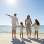 family looking out at the water on a Club Med beach resort