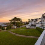 sunset view of Little River Inn in Mendocino and Pacific Ocean in the background