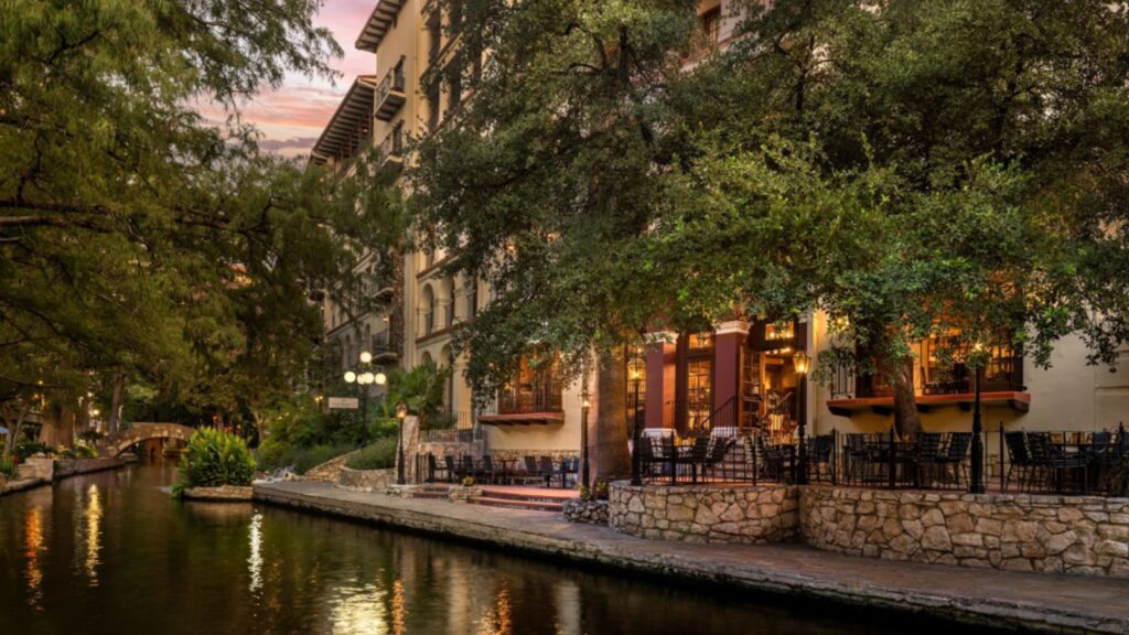 View of the Omni La Mansion del Rio and San Antonio Riverwalk at dawn