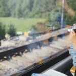 Young child looking out window of a scenic train in Europe