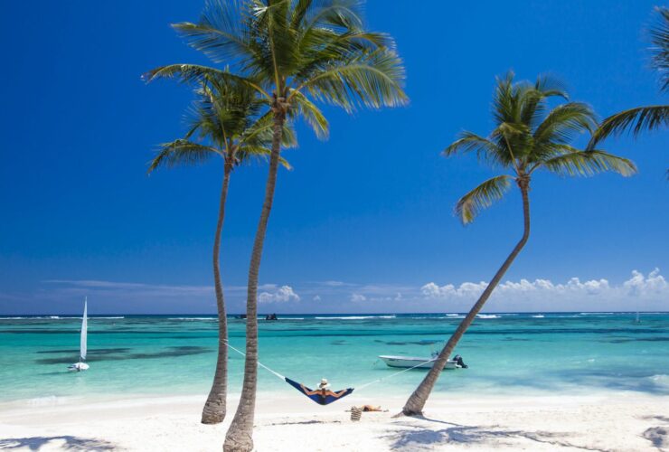 Person laying on hammock at Club Med beach location