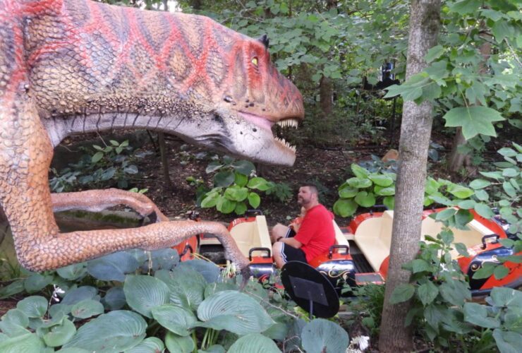 Passengers on boats encounter dinosaurs at the Columbus Zoo and Aquarium. Photo by Tim Trudell