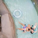 A family floating in the lazy river at Kartrite Resort