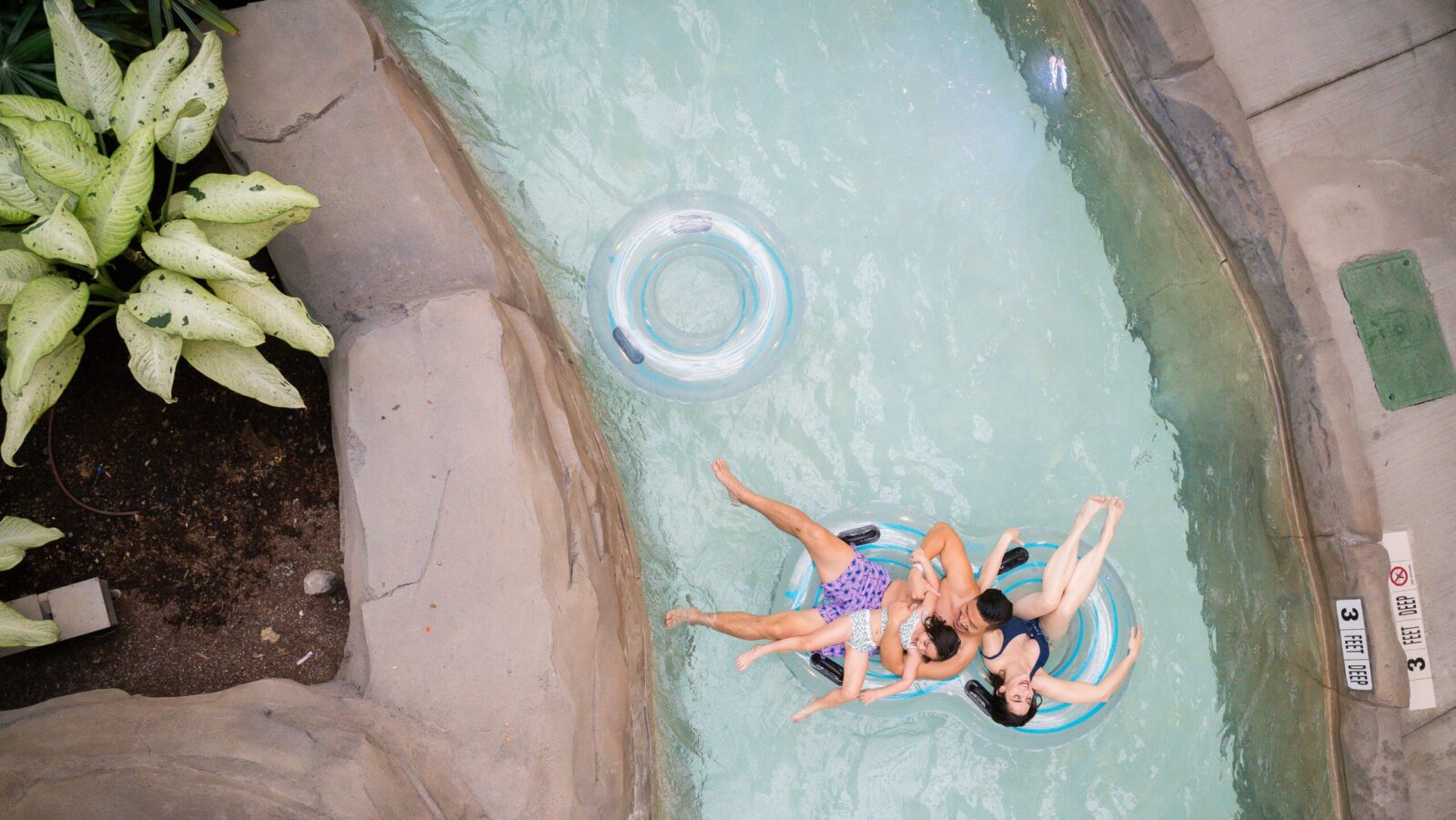 A family floating in the lazy river at Kartrite Resort