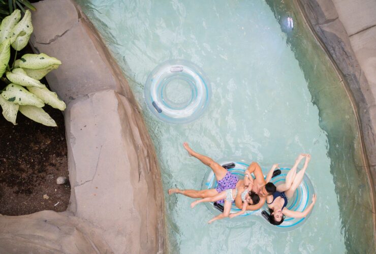 A family floating in the lazy river at Kartrite Resort