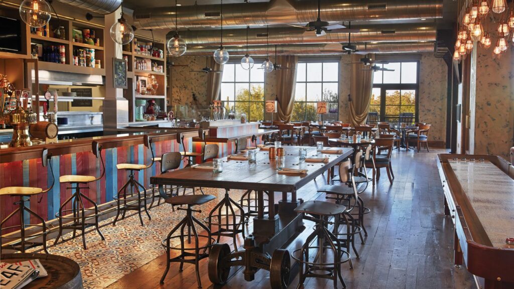 Proof restaurant’s shuffleboard table is a great way to keep kids entertained if there’s a wait — but we were seated each time immediately without reservations (Photo: Four Seasons)