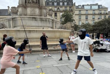 spectators fencing in front of St Sulpice during the Paris Summer Olympics