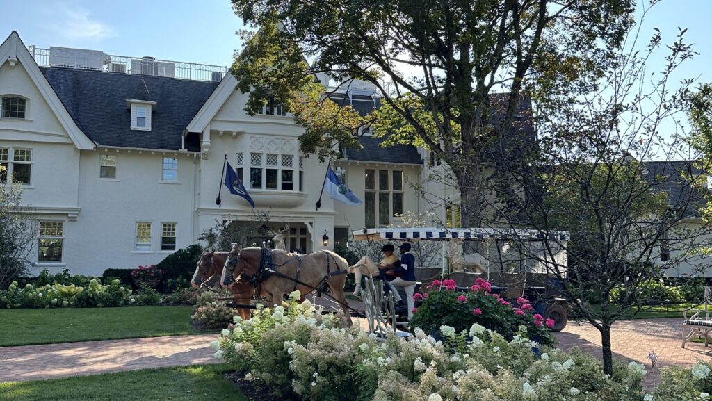 A horse-drawn carriage sits in front of The Mansion at The Inn at Stonecliffe