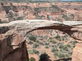 Wesley and Crosby stand atop an arch in Rattlesnake Canyon in Grand Junction, Colorado (Photo: Cynthia J. Drake)