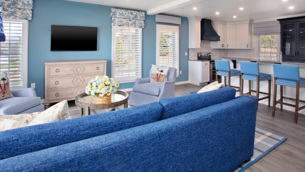 The living room and kitchen area of the Yacht Watch cottage at The Inn at Stonecliffe