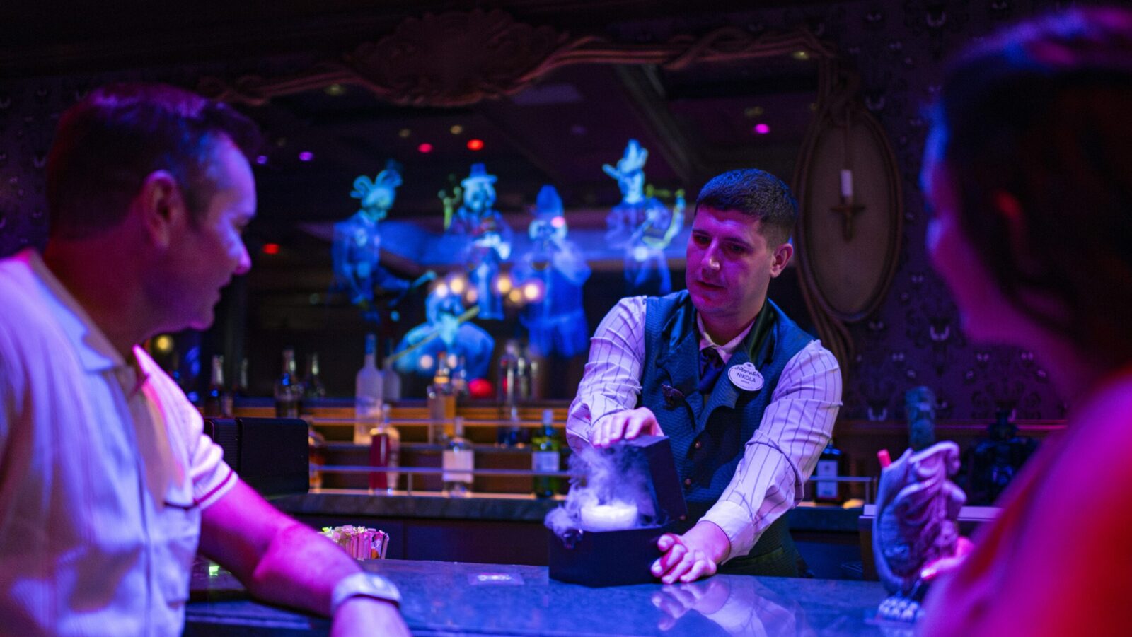 Guests inside the Haunted Mansion Parlor