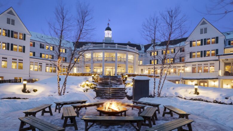 An exterior nighttime snowy view of The Sagamore Resort