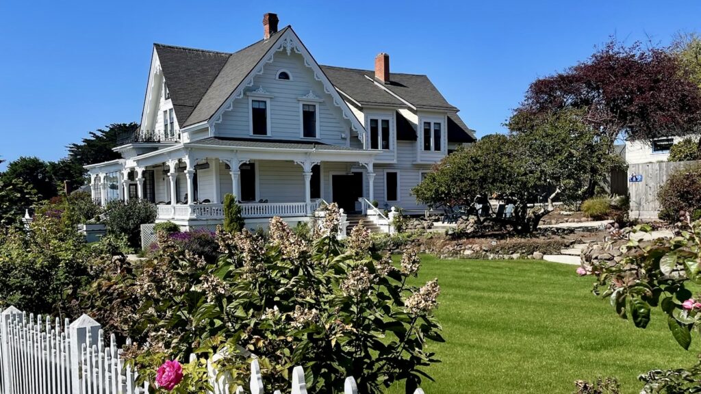 view of main inn at MacCallum House in Mendocino with garden in foreground